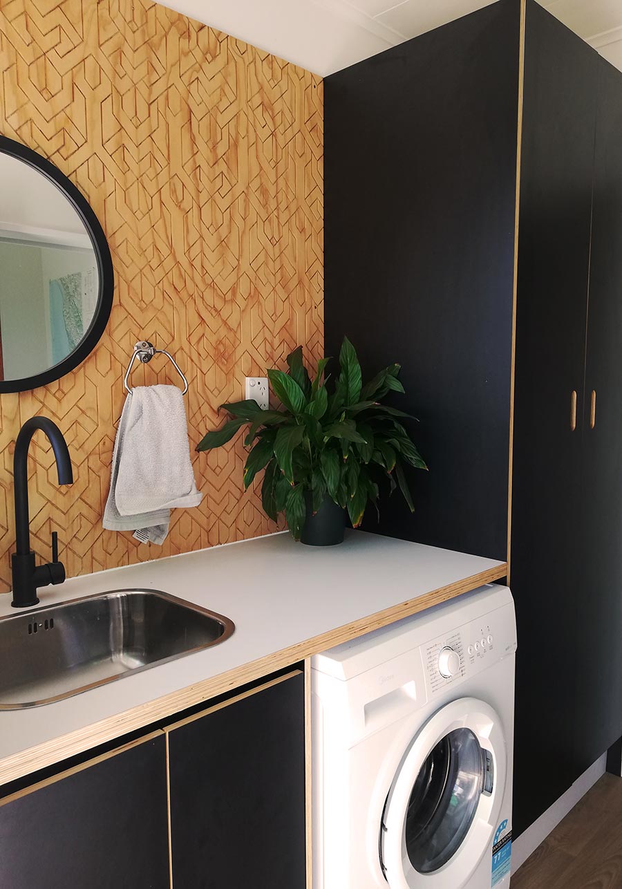 Warm and Minimal Laundry with an Art-Deco Twist